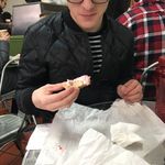 Stephen eating at Absolute Bagel