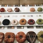 A spread of donuts in the display case