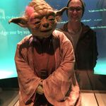 Stephen standing behind a Yoda display