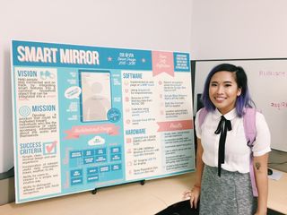 Me standing next to our senior design poster