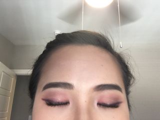 Monolid makeup look with peach colored eyeshadows with eyes closed